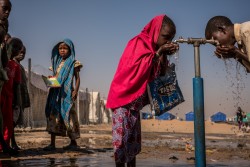 Children drink from a tap during recess at a UNICEF supported primary school inside Bukasi Internally Displaced People's camp, in Maiduguri, Borno State, Nigeria, Tuesday February 28, 2017. The prolonged humanitarian crisis in the wake of the Boko Haram insurgency has had a devastating impact on food security and nutrition in northeast Nigeria, leading to famine-like conditions in some areas, according to a World Food Programme (WFP) situation report from late February 2017. The United Nations Office for the Coordination of Humanitarian Affairs (OCHA) projects that by June 2017 some 5.1 million people in Nigeria will be food insecure at crisis and emergency levels. As of 15 March 2017, over the past 12 months, UNICEF and partners have provided safe water to nearly 666,000 people and treated nearly 170,000 children suffering from severe acute malnutrition in the three conflict-affected northeast Nigerian states of Borno, Yobe and Adamawa. As part of cholera preparedness, UNICEF and other WASH Sector partners are building the capacity of government and NGOs on cholera response and developing contingency plans with other stakeholders before the rainy season starting mid-April. Prepositioning of supplies for cholera response and mapping cholera hotspots are part of the preventive measures that are being planned.
