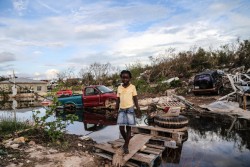Anastasia Chairet, 7, crosses an improvised wooden bridge which she built after Hurricane Irma caused severe damaged in the Five Cays' settlement of Providenciales, in the Turks and Caicos Islands, Saturday 16 September 2017. “I did this bridge myself so people can cross without getting wet,” explains Anastasia, with a cheeky smile. “I know every place and every one around here. Sadly, after the storm everything is a bit smelly,” she says wrinkling her nose. The aftermath of Hurricane Irma, a category five hurricane that hit the Caribbean between Wednesday 6 September and Sunday 10 September, is putting the well-being of hundreds of thousands of children in the Caribbean in danger. The extent of the devastation to Cuba and islands in the Eastern Caribbean is beginning to become clearer as rapid assessments are underway. With high winds, heavy rain and storm surges, Irma caused widespread damage to homes, schools, health centers and basic infrastructure across the region. Needs assessments are underway across all the islands affected by Hurricane Irma. UNICEF staff are on the ground, working in close coordination with government and implementing partners, evaluating the most urgent needs for children and adolescents. As of 14 September 2017, 132 schools are potentially affected in Anguilla, Barbuda, British Virgin Islands and Turks and Caicos islands.
