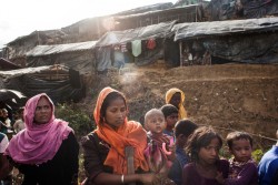 [Draft Caption]   New arriving Rohingya refugee's have been transported by truck to the newly built Kutupalong Makeshift Camp in a Rubber plantation. Cox Bazar - Bangladesh An unprecedented 200,000 child refugees have fled Myanmar and are now in urgent need of help, Unicef has warned, as the Rohingya crisis reaches new proportions. Minors make up at least 60 per cent of the 330,000 Rohingya who have crossed the border to Bangladesh over the past few weeks. Highly traumatised, they are arriving malnourished and injured after walking for days, By 5 September 2017, more than 146,000 Rohingya refugees fled across the border from Rakhine State, Myanmar, into Cox's Bazar district, Chittagong Division in Bangladesh since 25 August. As many as 80 per cent of the new arrivals are women and children. More than 70 000 children need urgent humanitarian assistance. More than 100,000 of the newly arrived refugees are currently residing in makeshift settlements and official refugee camps that are extremely overcrowded while 10,000 newly arrived refugees are in host communities. In addition, 33,000 arrivals are in new spontaneous sites, which are quickly expanding.  While some refugees are making their own shelters, the majority of people are staying in the open, suffering from exhaustion, sickness and hunger. Cox’s Bazar district of Bangladesh is one of the most vulnerable districts, not only for its poor performance in child related indicators but also for its vulnerability to natural hazards.  Most people walked 50 or 60 kilometers for up to six days and are in dire need of food, water and protection. Many children are suffering from cold fever as they are drenched in rain and lack additional clothes. Children and adolescents, especially girls, are vulnerable to trafficking as different child trafficking groups are active in the region. Many more children in need of support and protection remain in the areas of northern Rakhine State that have been wracked by violence. In
