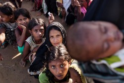[Draft caption]  A crowd of Rohingya Refuees waits at the Balukhali camp for the distribution of aid. An unprecedented 430,000 Rohingya refugees, over 240,000 of them children, have fled Rakhine State in Myanmar into Cox's Bazar district of Bangladesh.  Minors make up at least 60 per cent of the 430,000 Rohingya who have crossed the border to Bangladesh over the past few weeks. Highly traumatised, they are arriving malnourished and injured after walking for days to the safety of Bangladesh. Children arriving in the camps have endured long and dangerous journeys. Many have witnessed violence and lost family members. By 5 September 2017, more than 146,000 Rohingya refugees fled across the border from Rakhine State, Myanmar, into Cox's Bazar district, Chittagong Division in Bangladesh since 25 August. As many as 80 per cent of the new arrivals are women and children. More than 70 000 children need urgent humanitarian assistance. More than 100,000 of the newly arrived refugees are currently residing in makeshift settlements and official refugee camps that are extremely overcrowded while 10,000 newly arrived refugees are in host communities. In addition, 33,000 arrivals are in new spontaneous sites, which are quickly expanding.  While some refugees are making their own shelters, the majority of people are staying in the open, suffering from exhaustion, sickness and hunger. Cox’s Bazar district of Bangladesh is one of the most vulnerable districts, not only for its poor performance in child related indicators but also for its vulnerability to natural hazards.  Most people walked 50 or 60 kilometers for up to six days and are in dire need of food, water and protection. Many children are suffering from cold fever as they are drenched in rain and lack additional clothes. Children and adolescents, especially girls, are vulnerable to trafficking as different child trafficking groups are active in the region. Many more children in need of support and protection remain i