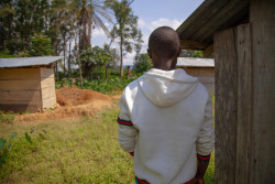 On 14 August 2018, 'Dieudonne' [not his real name], a thirteen year old boy who lost eight members of his immediate family to Ebola, stands in Ebola-affected Mangina, North Kivu, the Democratic Republic of the Congo (DRC).  “There were eight of them and they are all dead,” says Dieudonné*, a young 13-year-old boy living in Mangina, the Democratic Republic of the Congo, where 27 cases of Ebola were recently confirmed.  It all started when Dieudonné’s mother fell ill and died. “When we buried Mum, the family was next to her body,” the young boy explains. “Soon after, everyone began to have headaches and diarrhoea.”   When his big sister was admitted to the Ebola treatment centre, Dieudonné stayed in the little family home alone, the same house that was the starting point of all his hardship. “Everyone who entered our home fell sick,” the boy recalls. At only 13 years of age, Dieudonné has lost all his bearings, all the people that he loved and on whom he could count. “I don’t have anyone who can take care of me anymore,” sadly explains the young boy, who does not know if his sister will survive the disease. Dieudonné is one of 53 children orphaned by Ebola that UNICEF has identified in the east of the DRC. He currently benefits from psychosocial, material and dietary support. Dieudonné was also vaccinated against the disease a few days ago. The young boy does not what his future will be. “I have to continue to live but I do not know how I will make it,” he explains. “This is serious.” Following the 1 August 2018 announcement by the Government of the Democratic Republic of the Congo (DRC) of a new Ebola Virus Disease (EVD) outbreak in North Kivu, UNICEF has mobilized its teams to help contain the spread of the disease and protect children. The impact of an outbreak on children can be far reaching. It’s known from earlier outbreaks in the DRC as well as in West Africa that children can be affected in various ways. Children ca