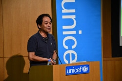 「子どもにやさしいまちづくりミニシンポジウム」に登壇した、粕川秀人氏（東京都町田市児童青少年課係長）