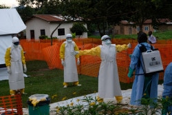 On 14 September 2018, medical workers are thoroughly cleaned after visiting patients at an Ebola treatment centre in Butembo, Democratic Republic of Congo, after a recent outbreak of the deadly disease.