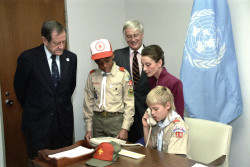 In an office at UNHQ, (left-right) UNICEF Executive Director James Grant, boy scout Brian, Under-Secretary-General Jan Martensen, UNICEF Goodwill Ambassador Audrey Hepburn and boy scout Michael make a collective telephone call to children at UN offices in Geneva, Switzerland, to announce the adoption of the United Nations Convention on the Rights of the Child that day. On receiving the news, the children in Geneva held a torch-lit procession through the city streets. UN Photo #275928 On 20 November 1989 at United Nations Headquarters (UNHQ), the UN Convention on the Rights of the Child was adopted by the UN General Assembly, after ten years of negotiations and debate. To celebrate this historic achievement, 500 children from around the world gathered to celebrate, joined by UN Secretary-General Javier Perez de Cuellar, UNICEF Goodwill Ambassador Audrey Hepburn, UNICEF Executive Director James Grant, UN delegates, NGO representatives and the media.