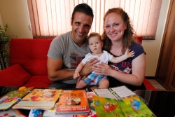 Young family with their first-born child (2 y.o). The father is engaging in reading and playing activities; baby is very responsive and intrigued. The family is supported with counseling, practical pieces of advice and emotional support by a visiting nurse from the UNICEF-supported Center for Maternal and Child Health in Sliven.
