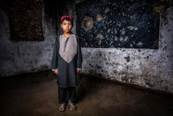 Abdul Hamid, 9, walks for two kilometers to reach this battered classroom that he shares with 44 other boys at Asad Soori school, Zheray district. Kandahar province, Afghanistan,16 April 2019. Abdul has six brothers, who go to the same school — one is his classmate — and two sisters. “My father doesn’t allow my sisters to go to school. He is concerned about their safety," Abdul says. Intense fighting in Zheray, followed by air strikes, destroyed Asad Soori in 2007, which once hosted 1,300 students. Reopened by the villagers in 2014, the school now has 365 students, of whom 50 are girls. “There is a huge demand for education in Zheray," says Nasir Ahmad, one of Asad Soori's teachers. While Abdul and his classmates didn’t witness the war here, the destruction reminds them of the horrific days — many of them are scared of it happening again. Teachers at Asad Soori school have benefited from UNICEF training, while students have received basic stationary materials from the UN agency.