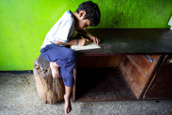 On 25 July 2019, Petare Community, Caracas, Venezuela.  9-year-old Duglianis González Sánchez brother, Luis Alfredo Celis (6) makes his homework in their house in the community of Petare, Caracas, Venezuela.  Water, sanitation and hygiene are essential for the survival and development of children and their families. In the most vulnerable communities of Venezuela, access, quantity, continuity and water quality are the main concerns. This situation is aggravated with the power outages in recent months. One of such communities is Petare, located in the outskirts of Caracas, the capital city. “If it rains, we grab rainwater. Sometimes the water comes clean and sometimes it comes dirty. We collect it from the pipes, and I help my dad to carry it into the house so we can store it in a tank,” explains proudly 9-year-old Duglianis González Sánchez. “We boil it and then we can drink it.”  Duglianis has lively eyes and a radiant smile. She lives with her siblings and parents in a building in one of the sectors of the Petare neighborhood, known as Cacagüita.  Pumping system of El Carmen and Urbina, which provide running water to 65 percent of the Cacagüita sector, are currently being repaired. In the meantime, the Municipal Institute of Water of Sucre is responsible for supplying the water trucks, while UNICEF ensures water chlorination. In coordination with water authorities and partners, ensuring access to clean and safe water for children and families is a top priority for UNICEF.   Together with national and local authorities, UNICEF's work will gradually allow the rehabilitation of underground and surface water sources, the repair of distribution networks and pipelines, the distribution of water at strategic points such as hospitals and the rehabilitation of pumping stations in the country. As part of an agreement with the Ministry of Water, UNICEF is working on expanding the supply of safe drinking water through systems repair and extension, water-tru