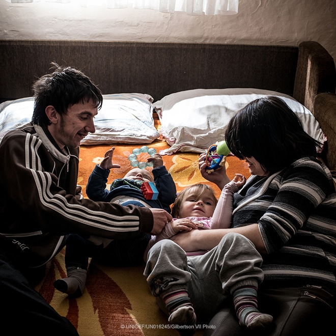 A couple play with their two children, Serbia